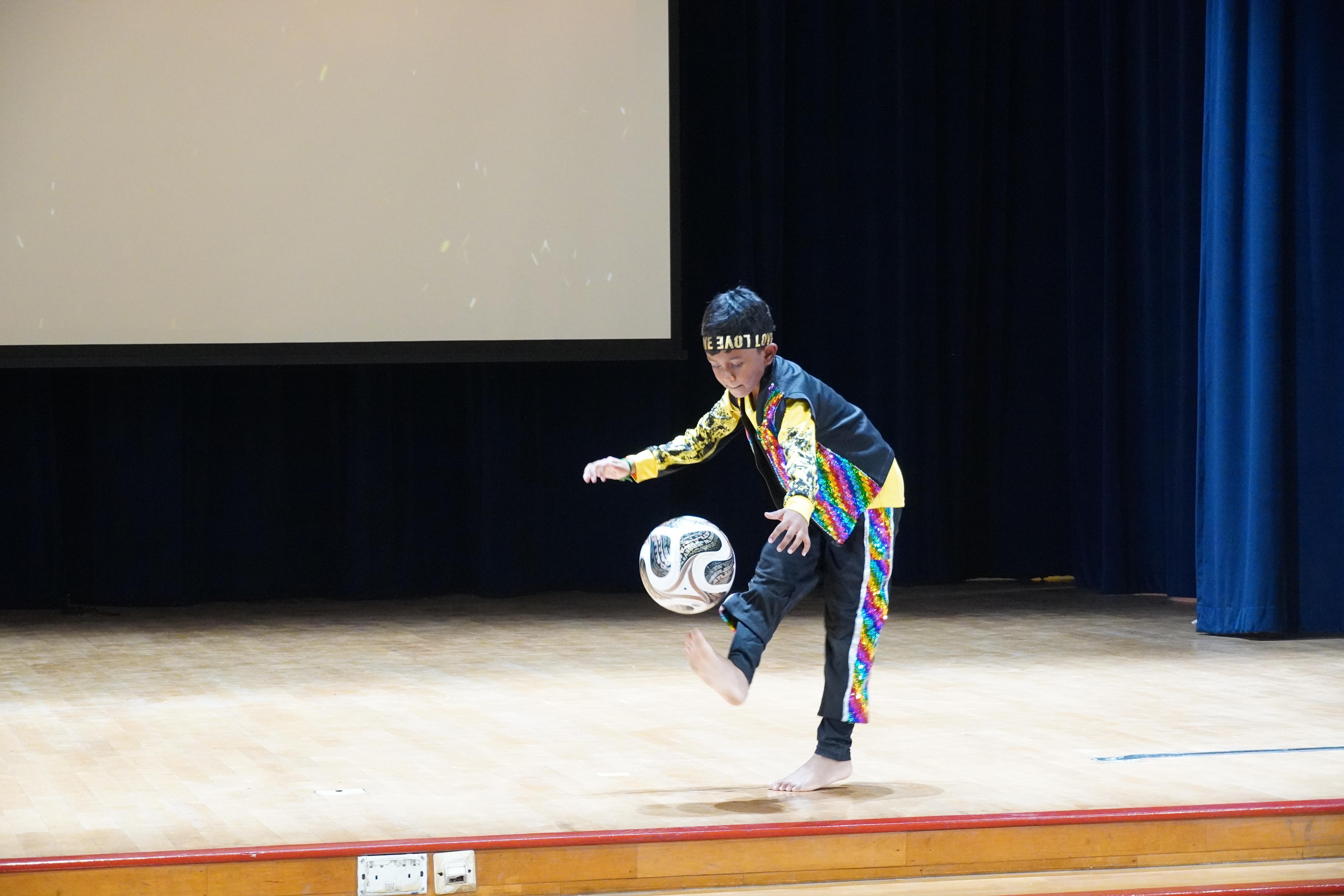 Fancy footwork in action! Our student wowed the audience with his impressive football skills.